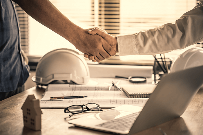 Architect shacking hands with engineer
