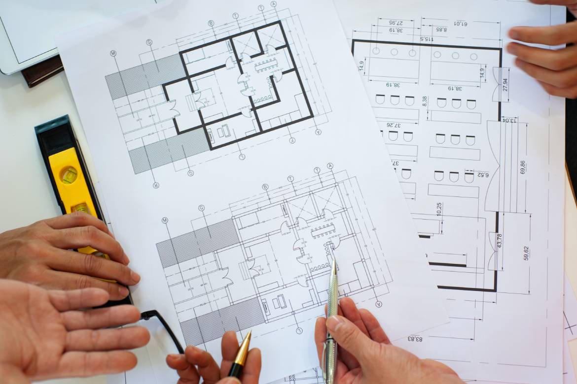 Close-up, architects team are brainstorming, designing and drawing the structure of the building.