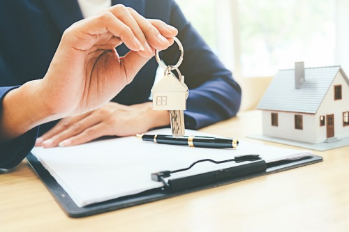 House model with real estate agent and customer discussing for contract to buy house, loan real estate background.