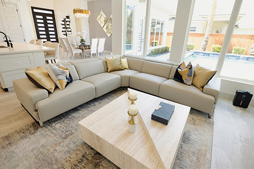 Contemporary living room with a couch and coffee table, highlighting new construction features in Mission, TX.