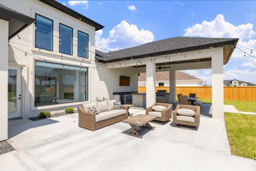 Designed by Dolcan Home An inviting outdoor patio with stylish furniture, creating a perfect setting for leisure and gatherings.